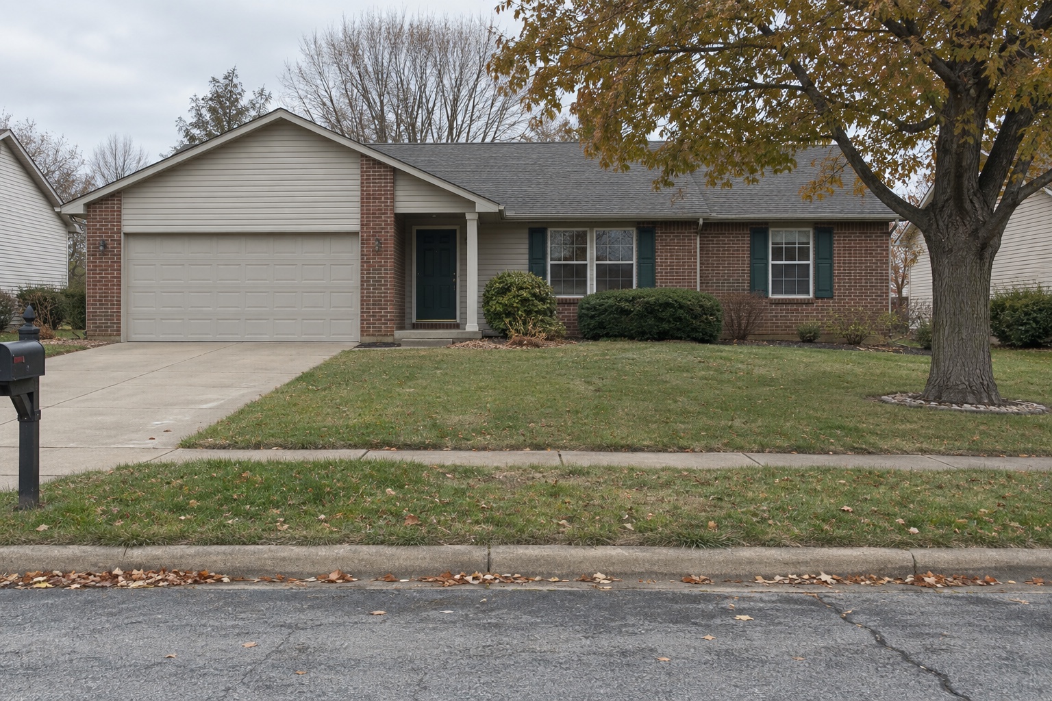 Prior street-facing view of a single-story brick-and-siding home